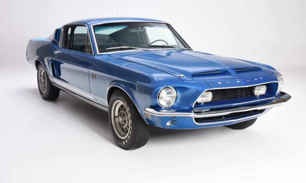 Classic blue 1960s Ford Mustang with chrome details.