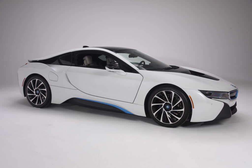 Sleek white sports car with modern design and blue accents.