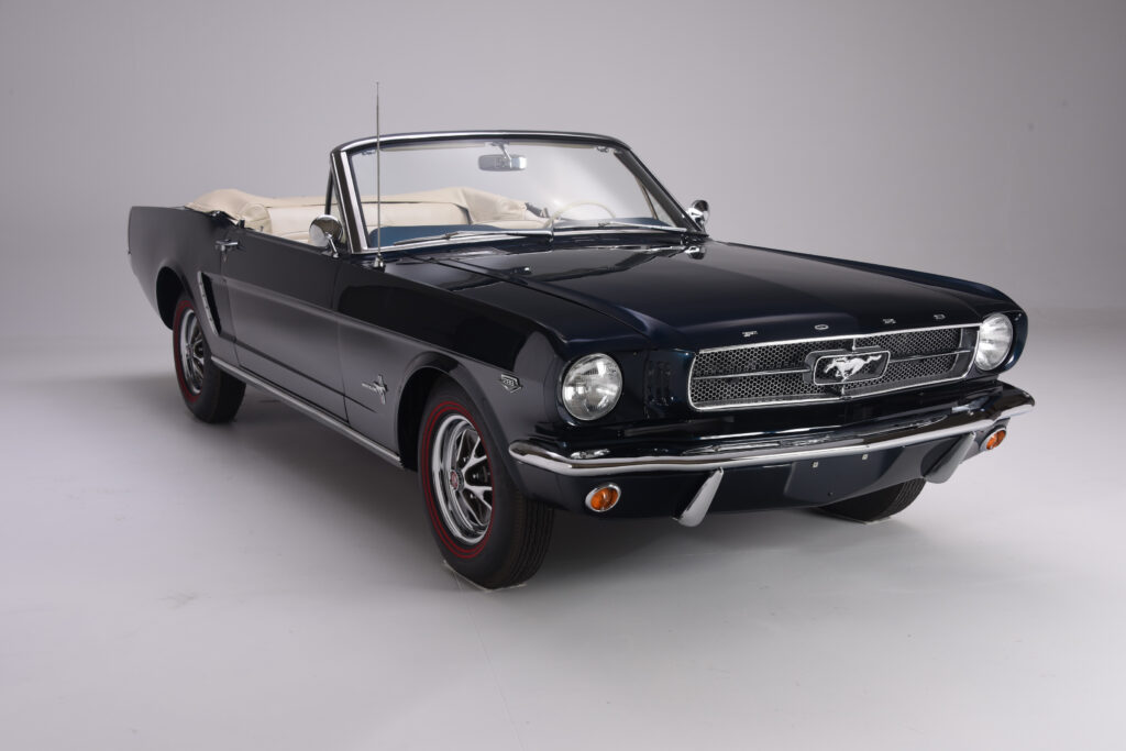 Classic black Ford Mustang convertible from the 1960s.