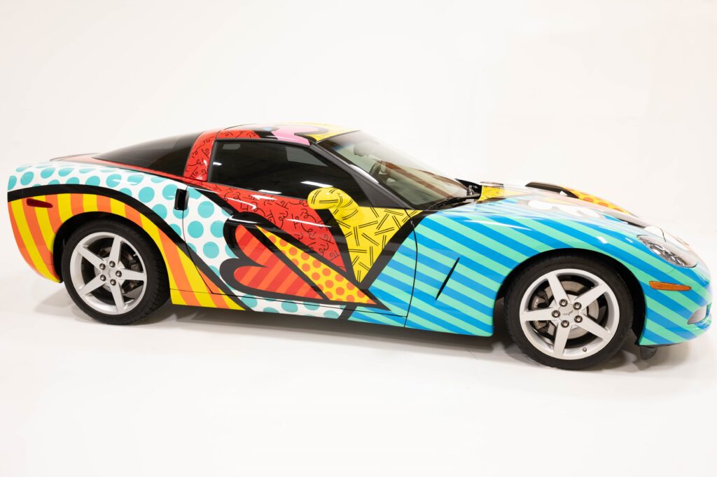 A colorful toy car with vibrant, abstract patterns.