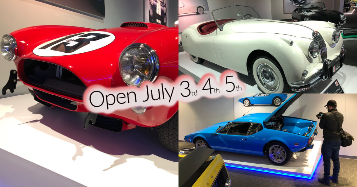 Classic cars with a sign announcing an event on July 3, 4, and 5.