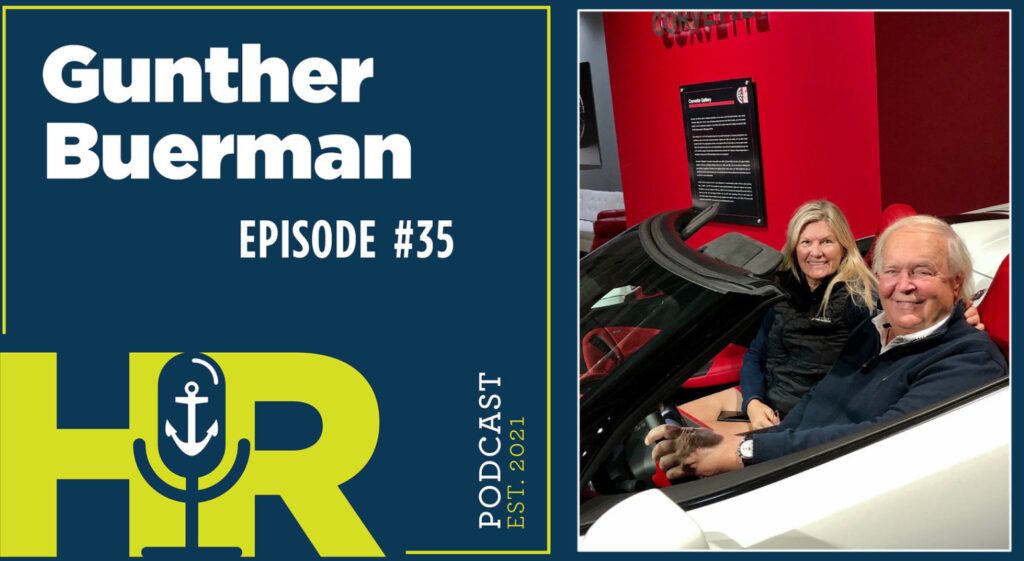 Podcast episode featuring a man with a car engine, discussing auto topics.