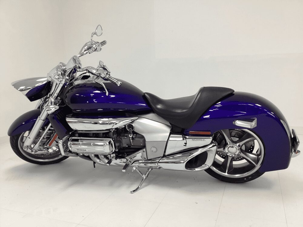 Sleek purple and silver motorcycle with modern design and chrome detailing.