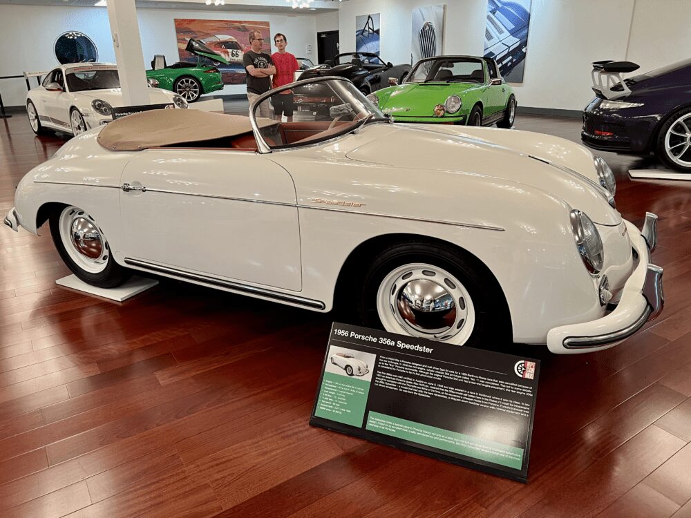 Classic white convertible car displayed indoors with a vintage appeal.