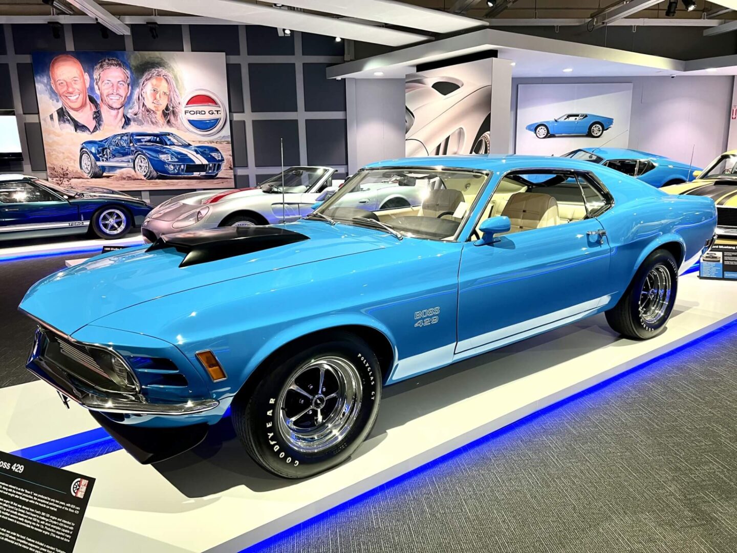 Classic blue 1970 Ford Mustang on display with polished chrome details.