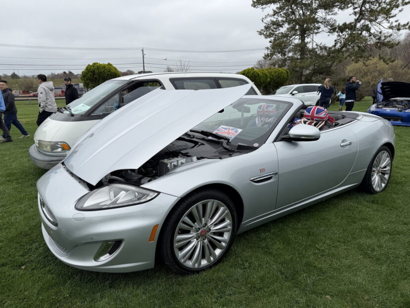 Silver convertible sports car with open hood