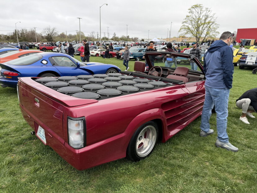 Custom maroon convertible truck with speakers