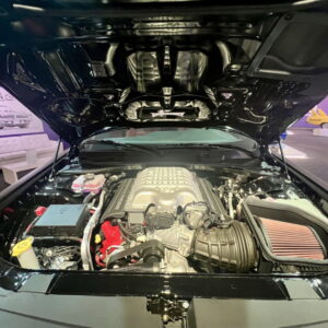 Open hood revealing modern car engine